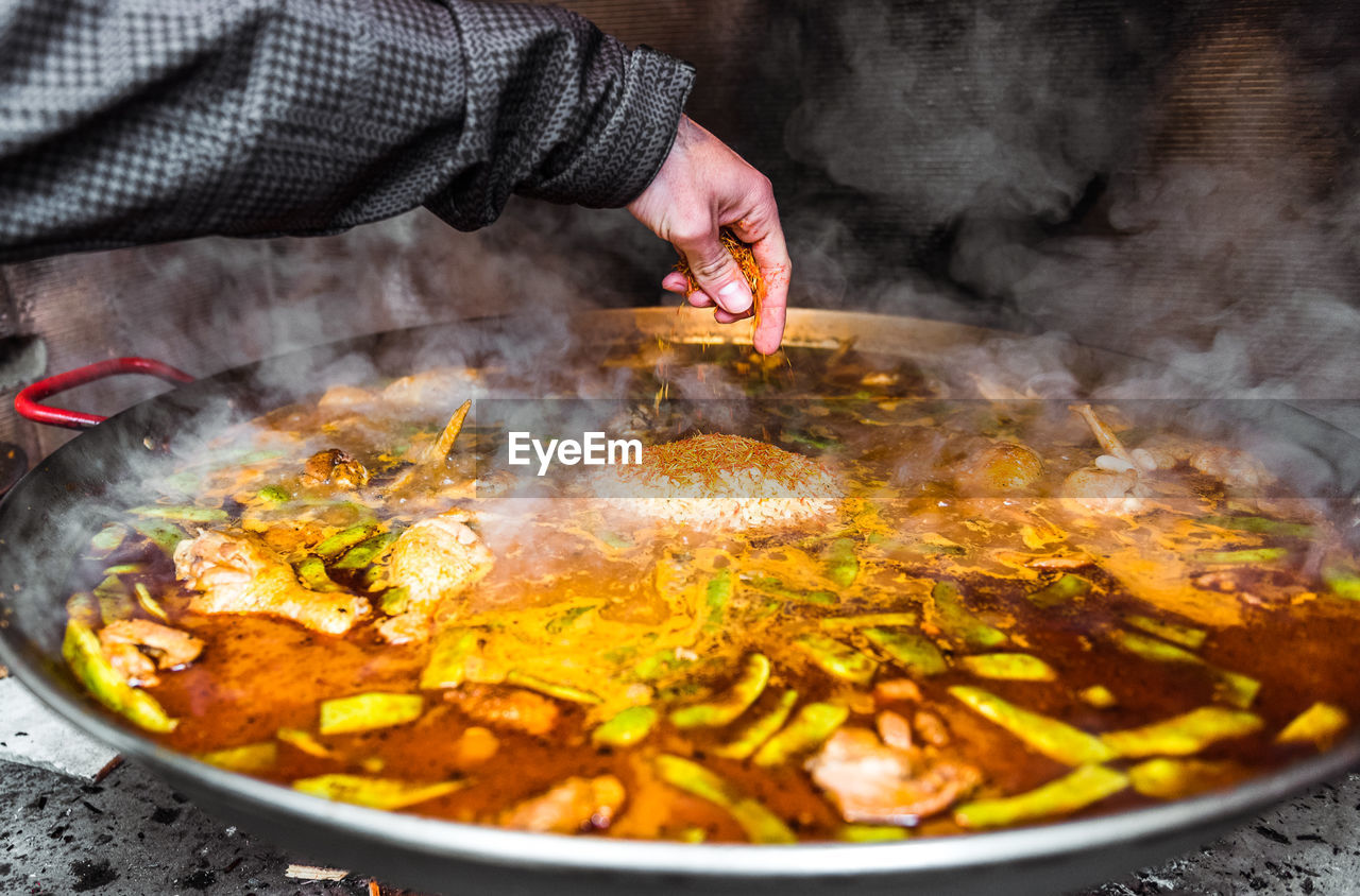 Close-up of hand preparing food in kitchen