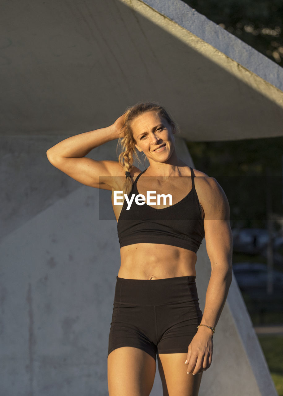 Smiling woman wearing fitness clothes