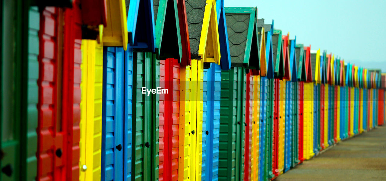 Colorful beach huts in row