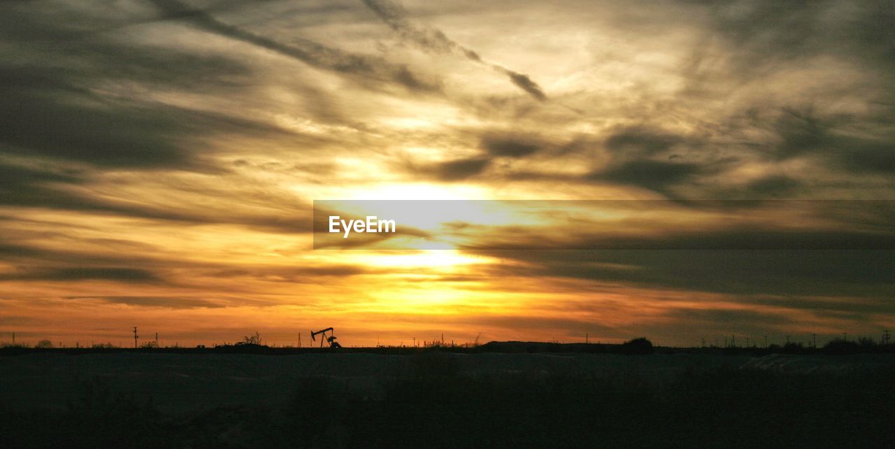 Scenic view of silhouette landscape against sky during sunset