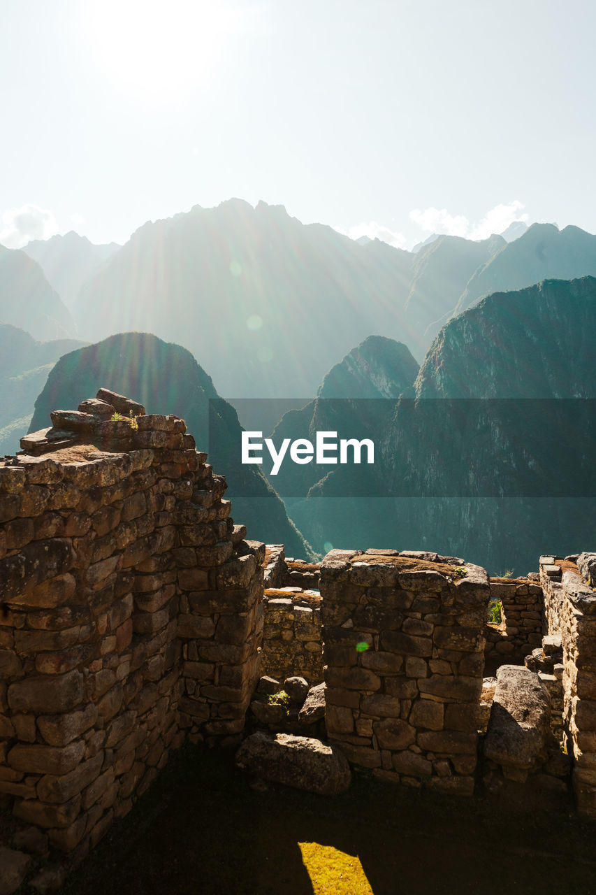 Machu picchu old inca ruins at sunrise in peru