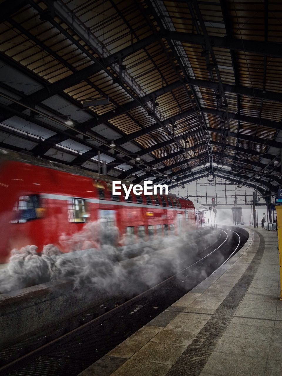 Digital composite image of smoke coming out from train