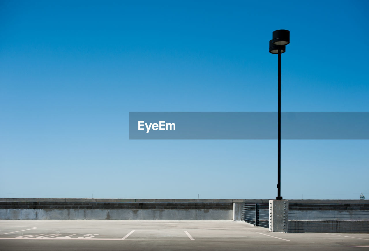 LOW ANGLE VIEW OF STREET LIGHT AGAINST SKY