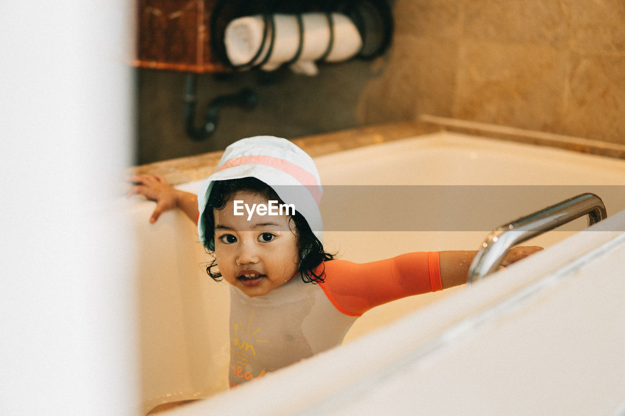 Portrait of girl in bathroom at home