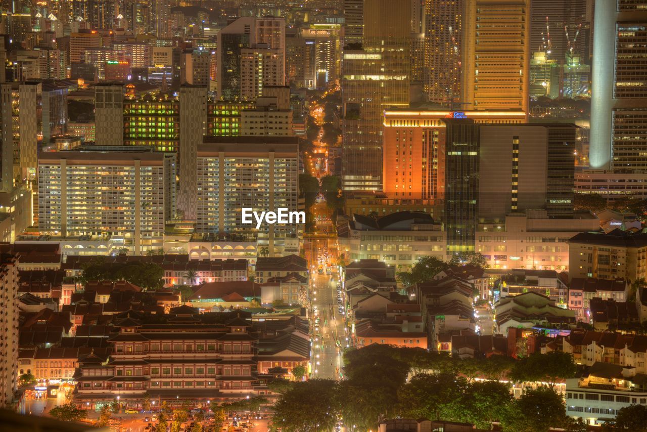 Aerial view of city lit up at night