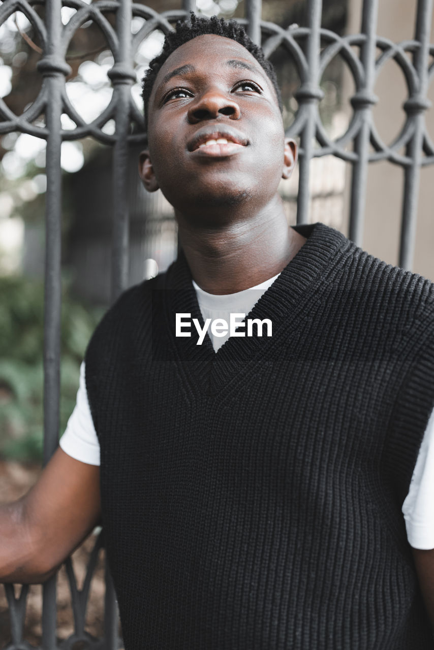 Young african american man outdoor, street portrait. fall or spring season