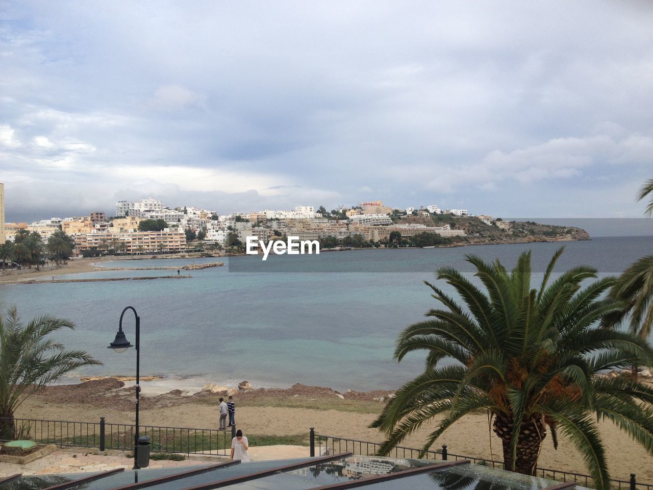 vacation, palm tree, water, sea, sky, tropical climate, coast, nature, tree, architecture, travel destinations, beach, cloud, city, travel, plant, land, transportation, building exterior, day, built structure, bay, holiday, trip, ocean, outdoors, tourism, beauty in nature, scenics - nature, mode of transportation, shore, car, no people, building, vehicle, motor vehicle, tourist resort