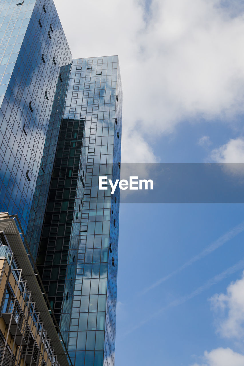 Low angle view of modern buildings against sky