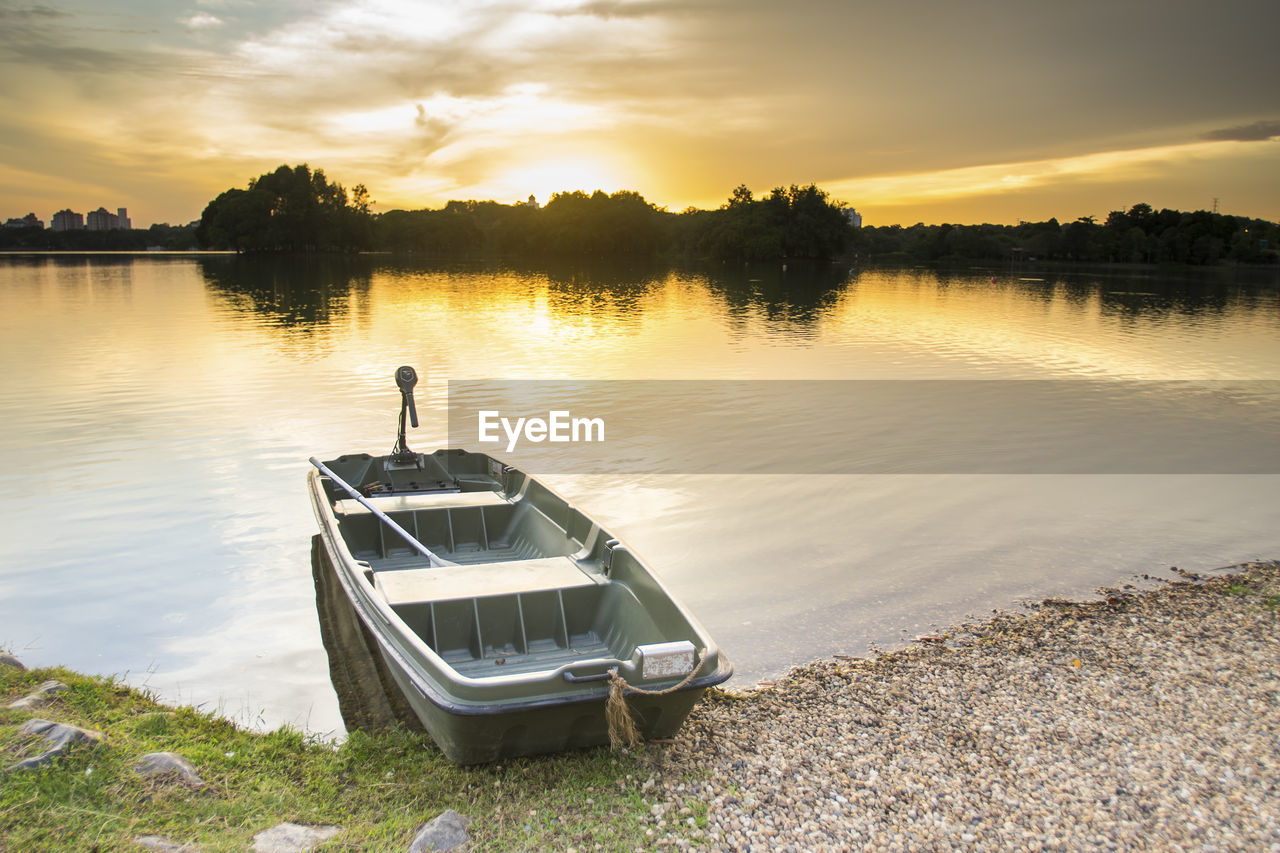 Scenic view of lake against sky during sunset