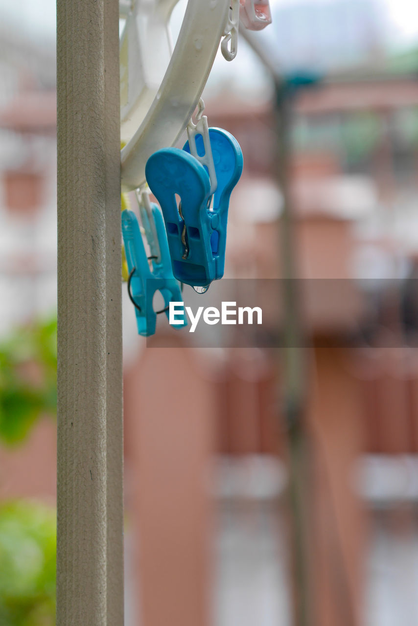 Close-up of clothespin hanging outdoors