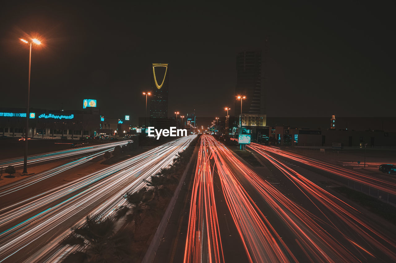 High angle view of light trails on highway at night