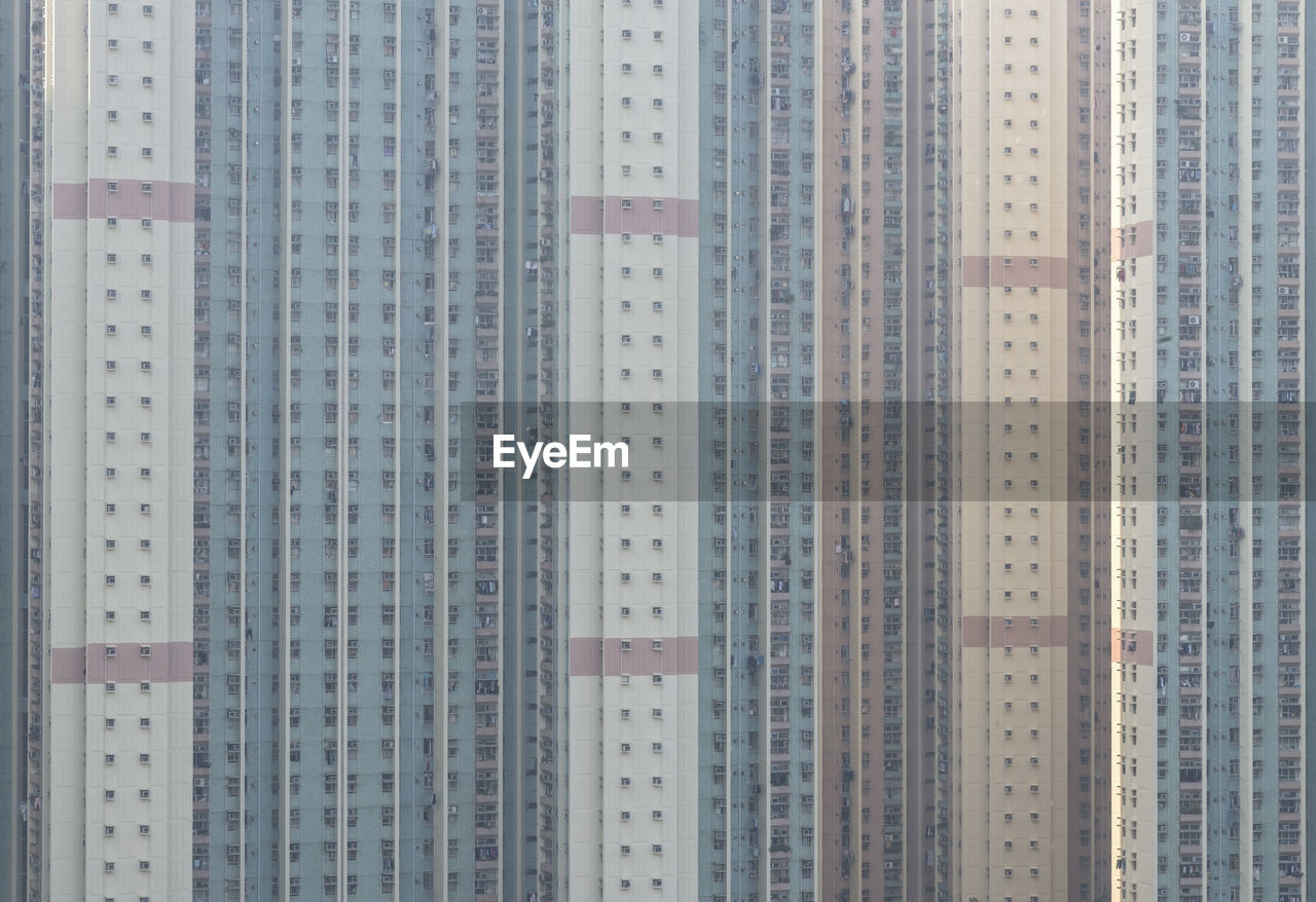 Low angle view of illuminated buildings against sky in city