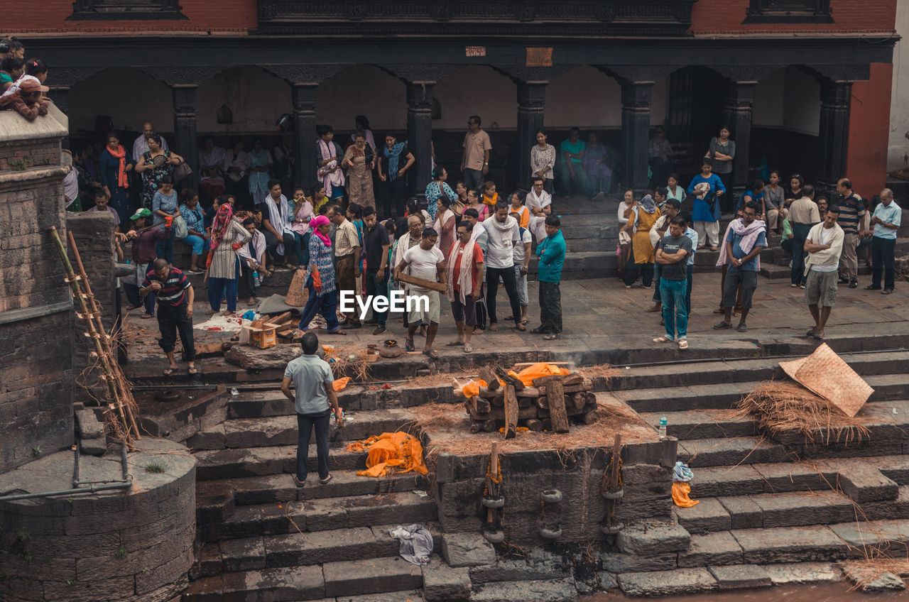 GROUP OF PEOPLE IN TRADITIONAL TEMPLE