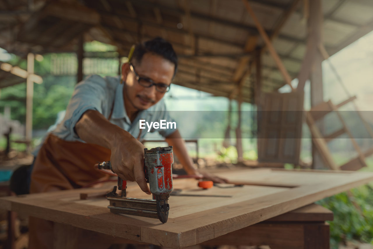 Carpenter working at workshop