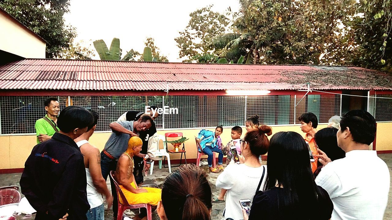 PANORAMIC SHOT OF PEOPLE PHOTOGRAPHING