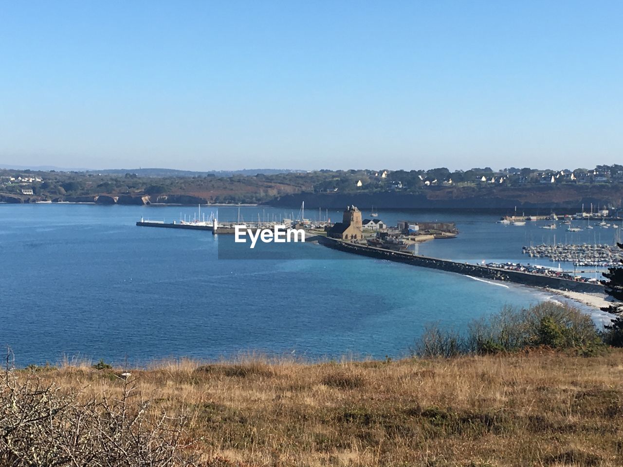 Scenic view of bay against clear sky