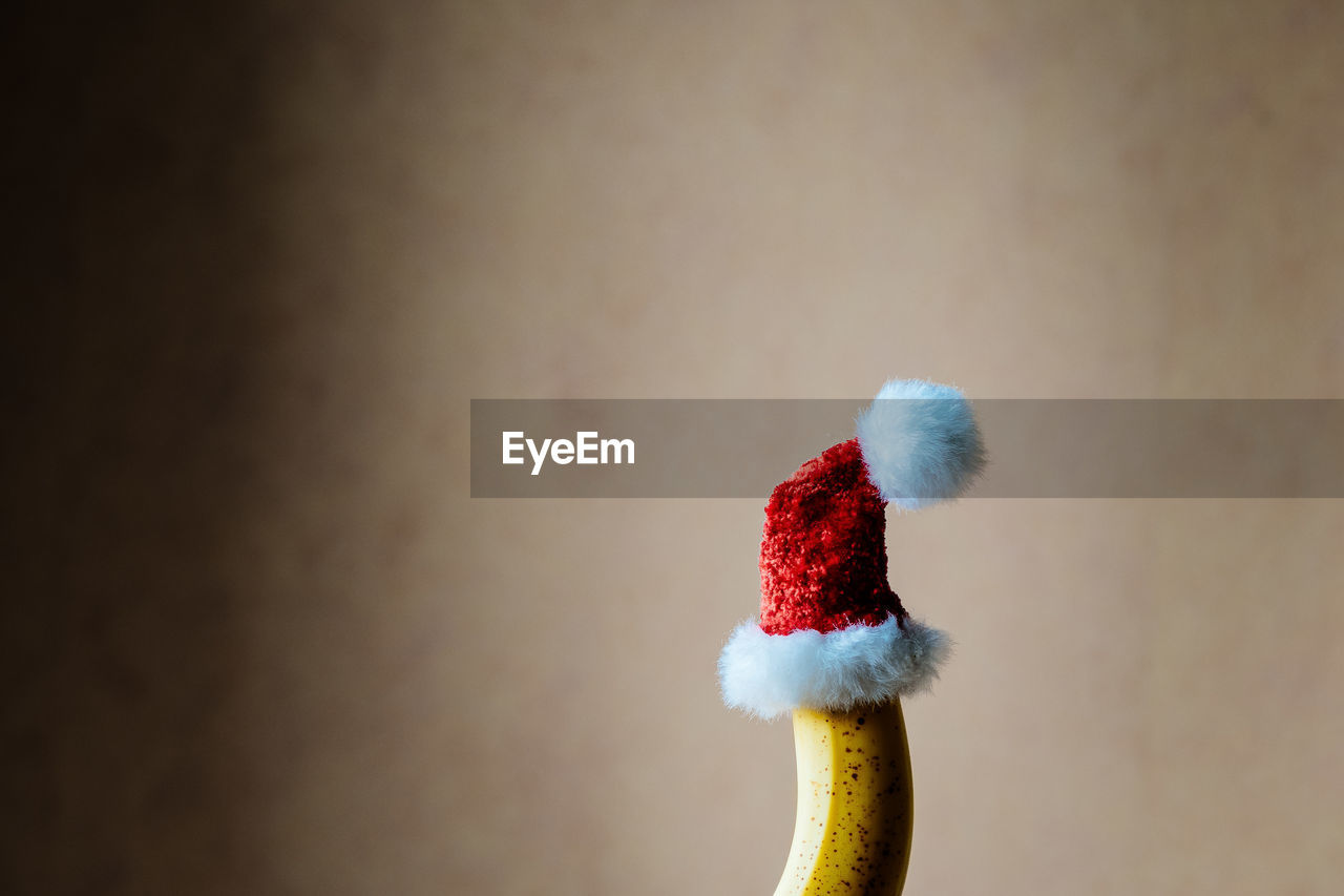 Close up of banana in santa hat