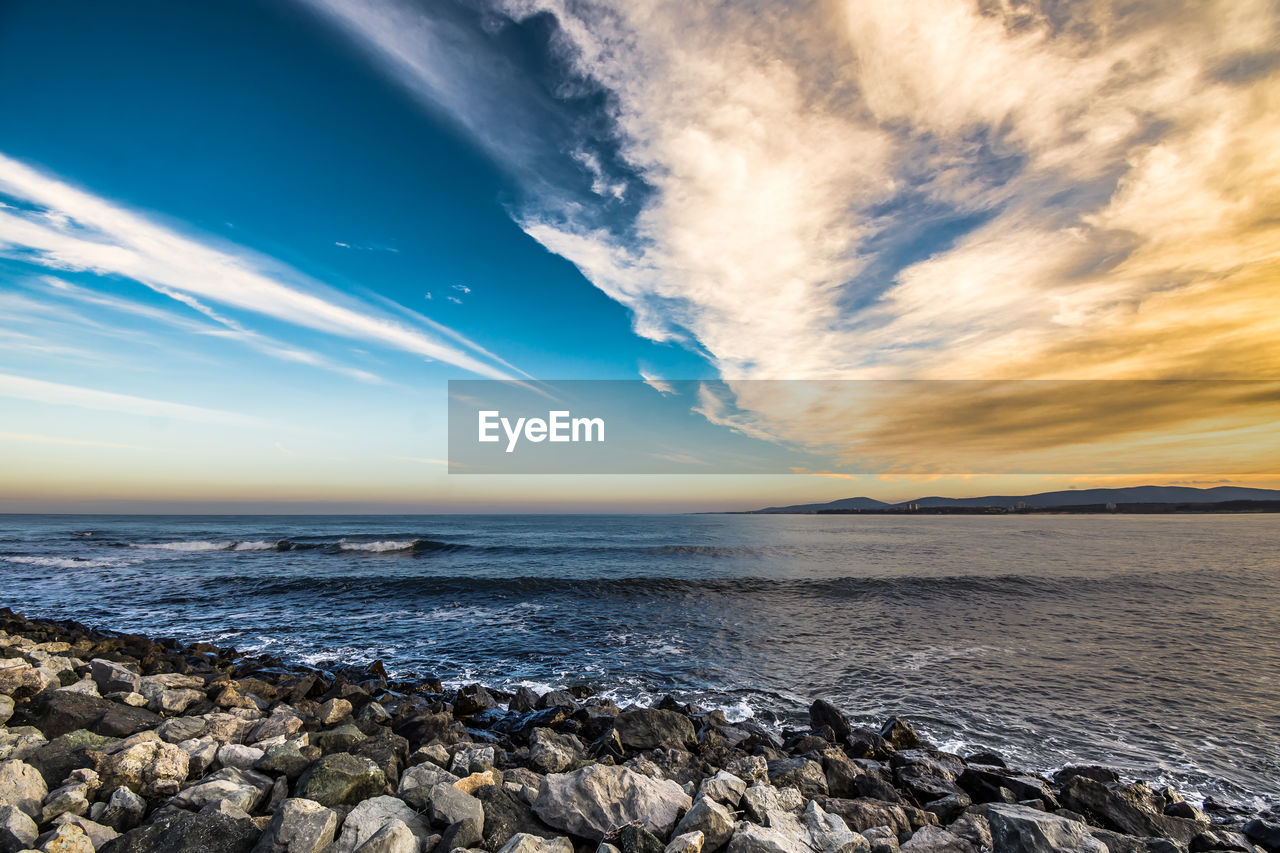 Scenic view of sea against sky during sunset