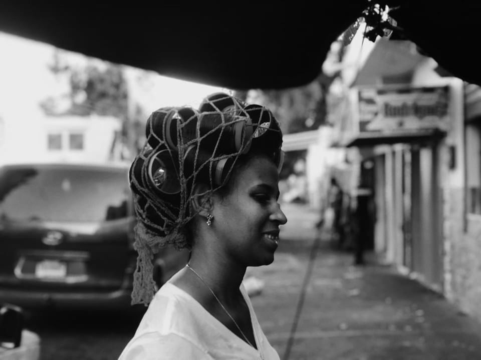 black, black and white, white, one person, monochrome, monochrome photography, adult, portrait, car, young adult, architecture, women, headshot, focus on foreground, vehicle, city, side view, transportation, lifestyles, looking, female, looking away, person, mode of transportation, clothing, street, outdoors, emotion