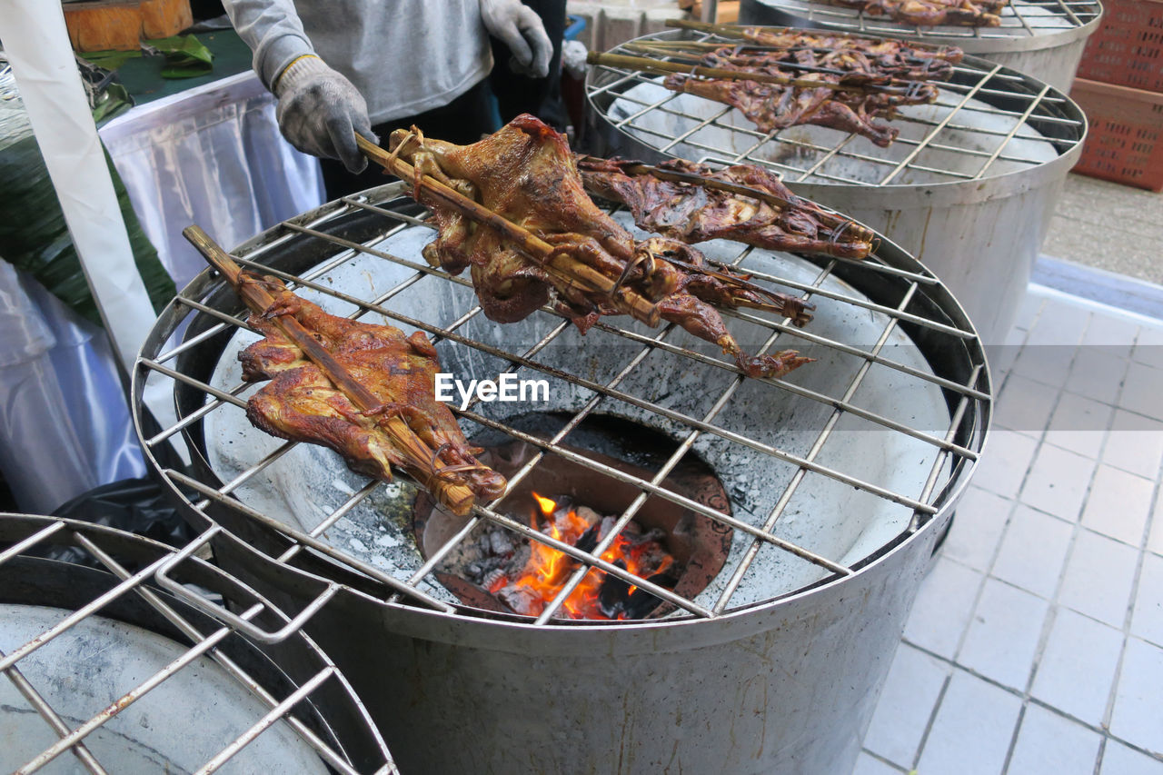 High angle view of meat on barbecue grill