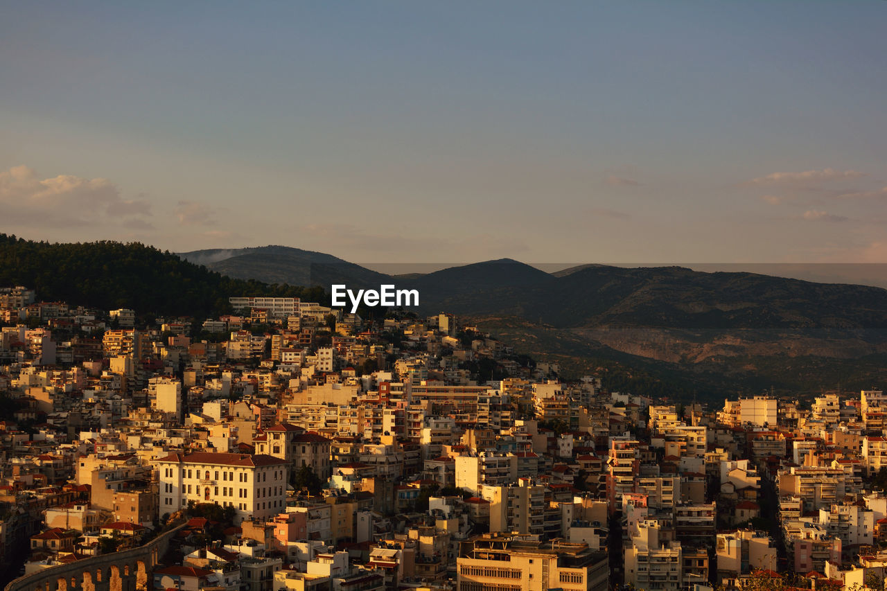 High angle view of townscape against sky at sunset