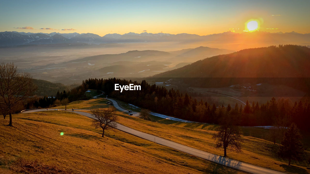 Scenic view of landscape against sky during sunset