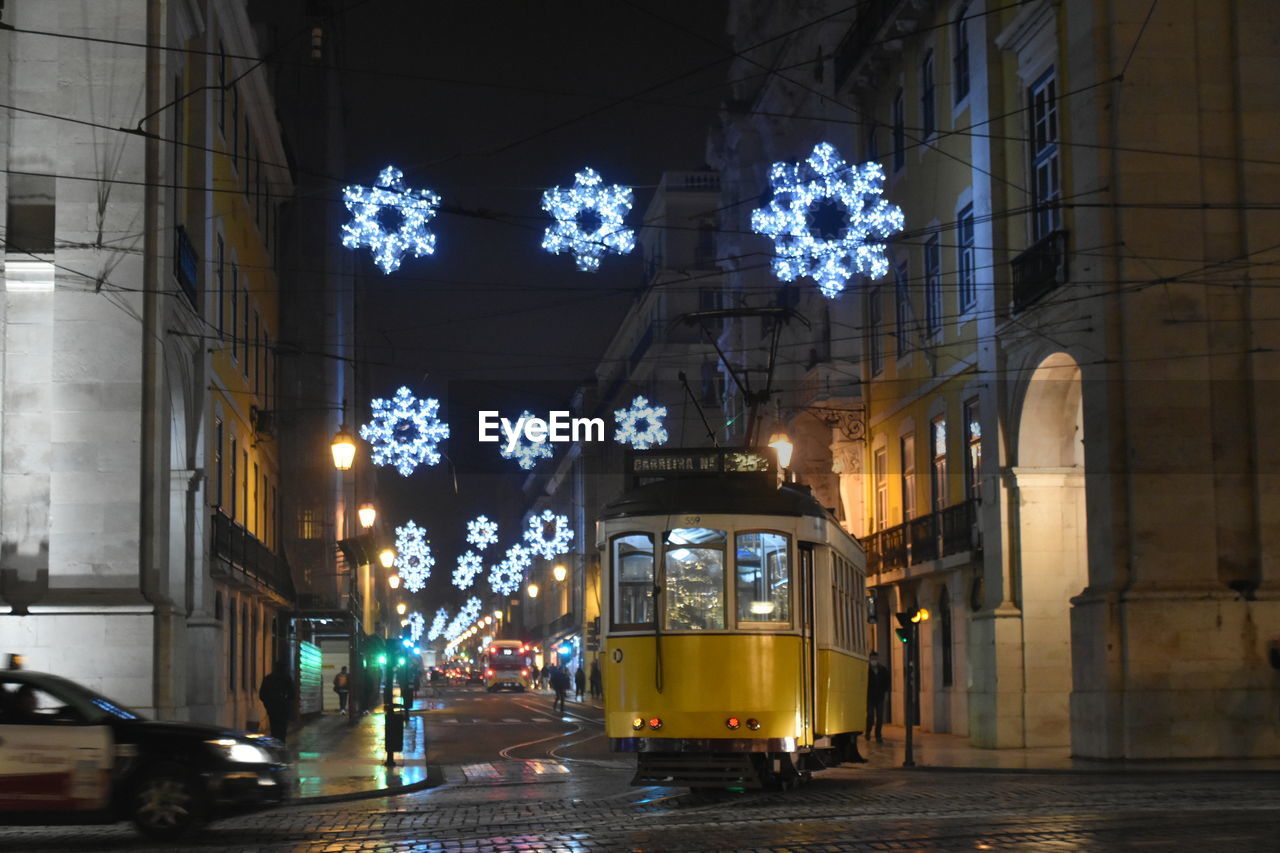 Illuminated city street at night