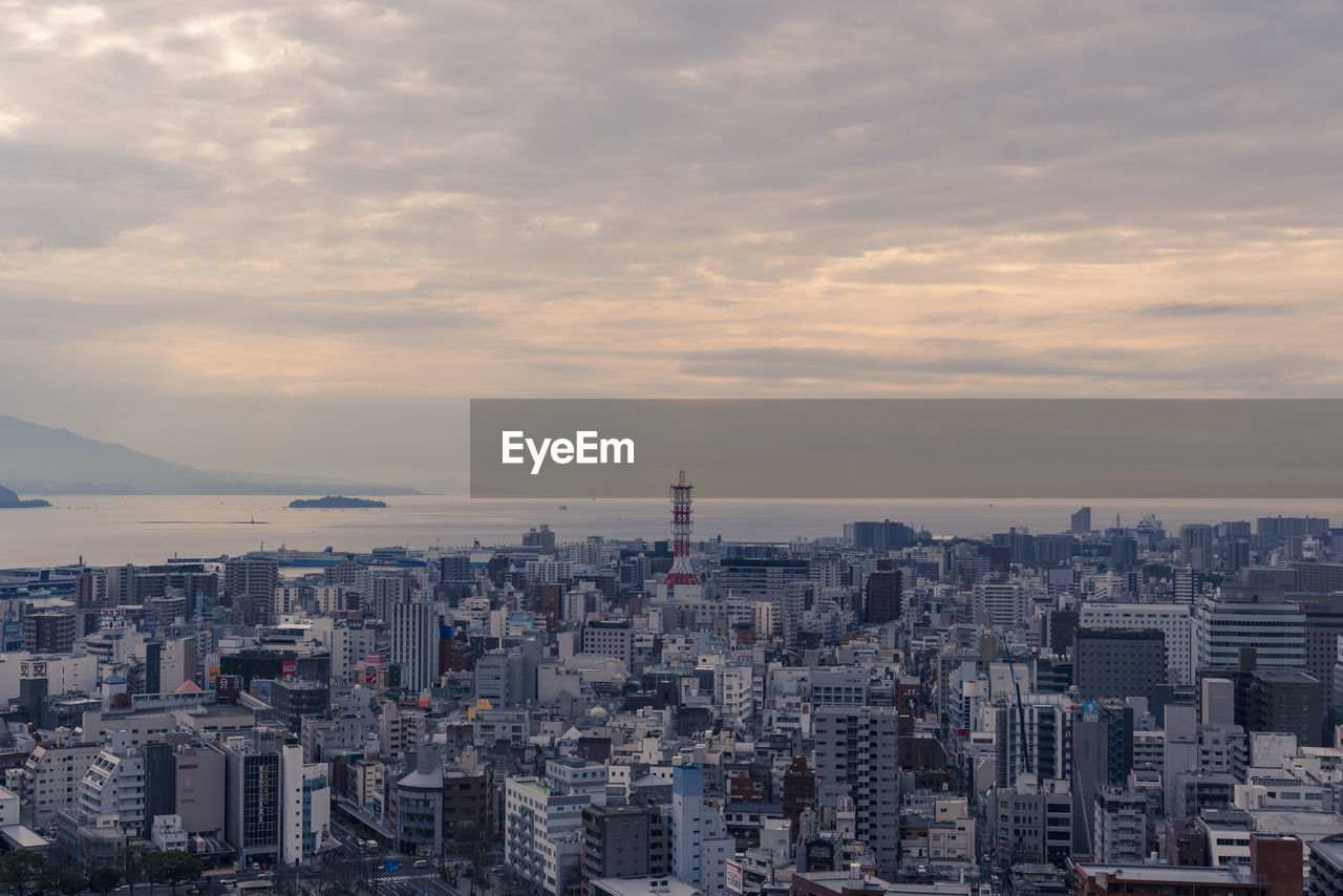 High angle view of buildings against sky during sunset