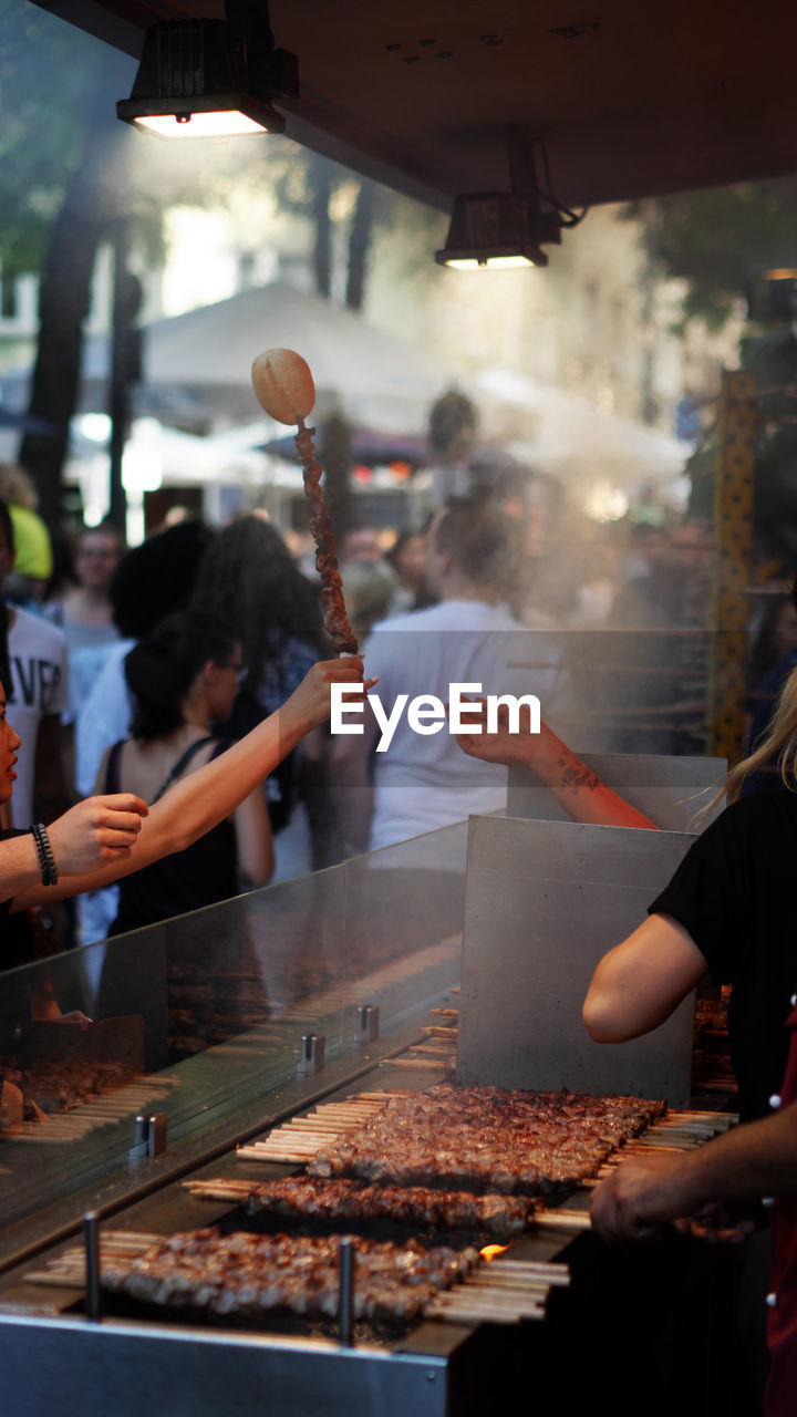 GROUP OF PEOPLE IN RESTAURANT