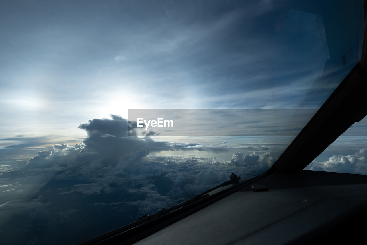 AERIAL VIEW OF SKY SEEN THROUGH CAR WINDOW