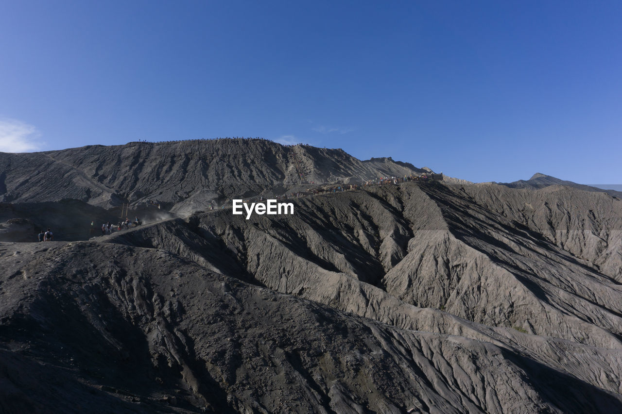 Scenic view of rocky mountains against sky mount bromo