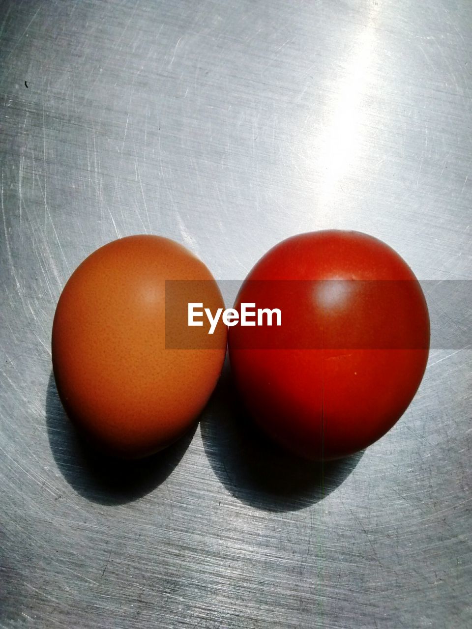 Close-up of egg and tomato on table