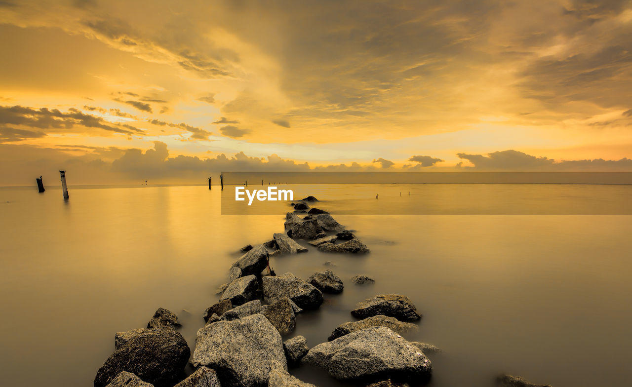 Calm sea against scenic sky