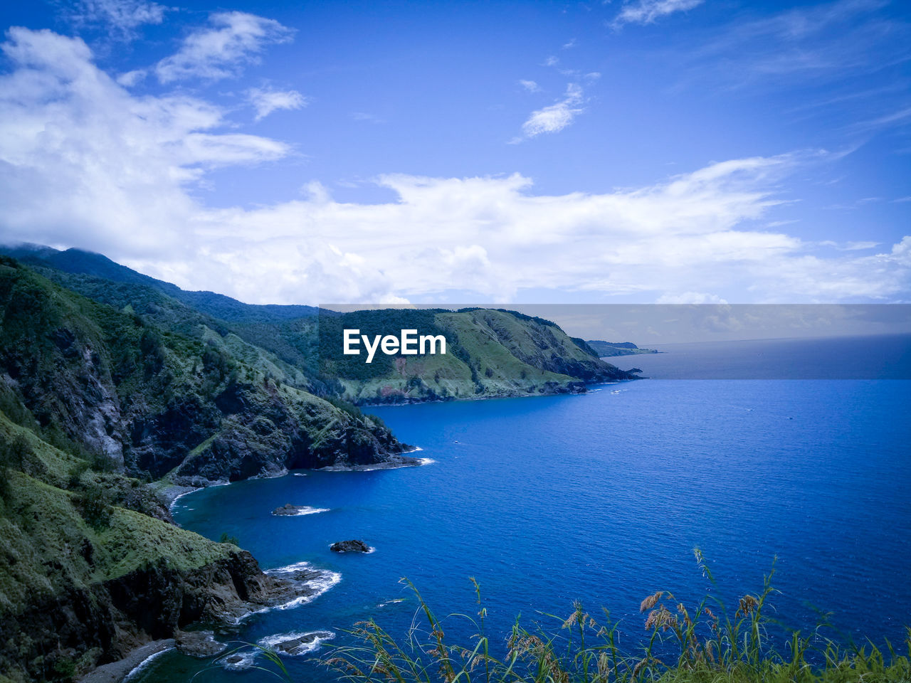 Scenic view of bay against sky