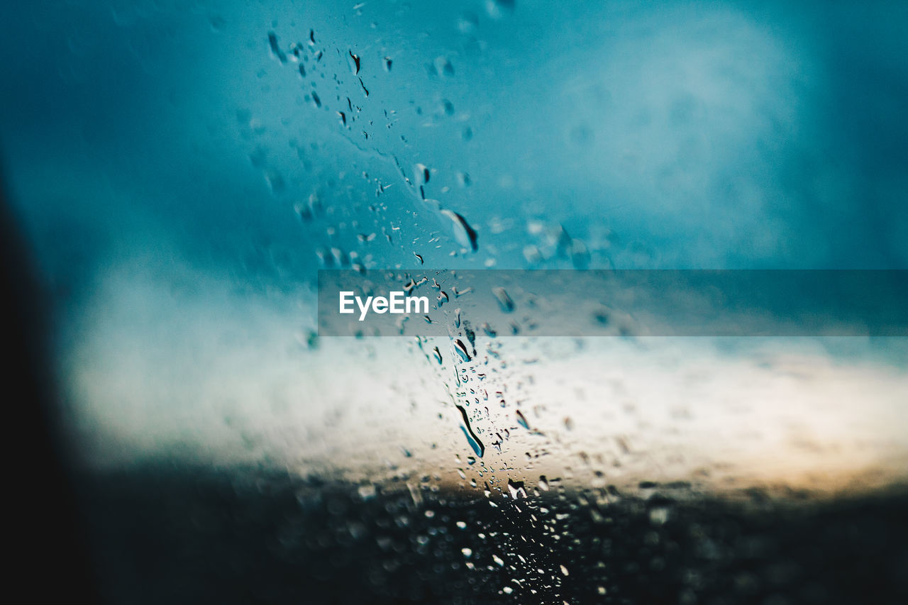 Close-up of raindrops on glass window