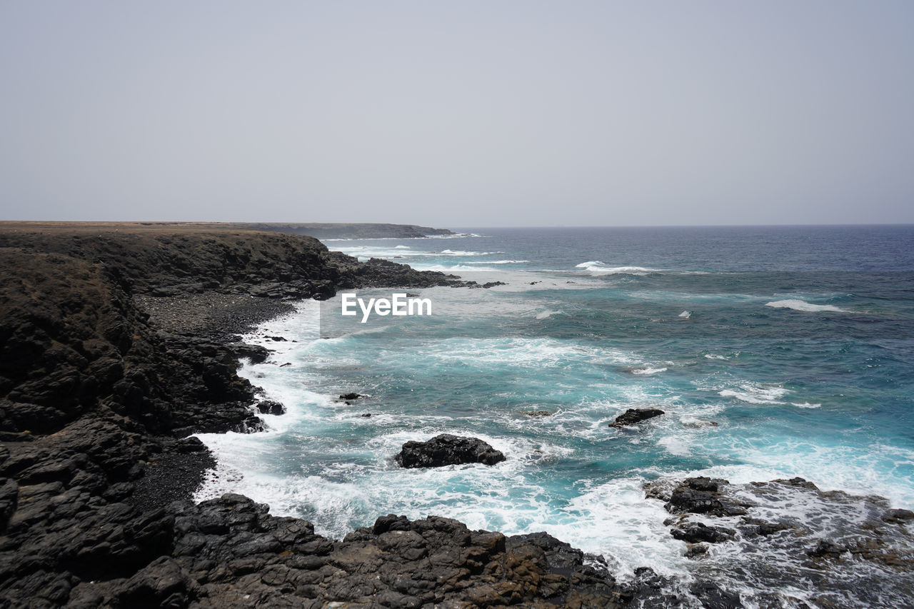 Scenic view of sea against clear sky