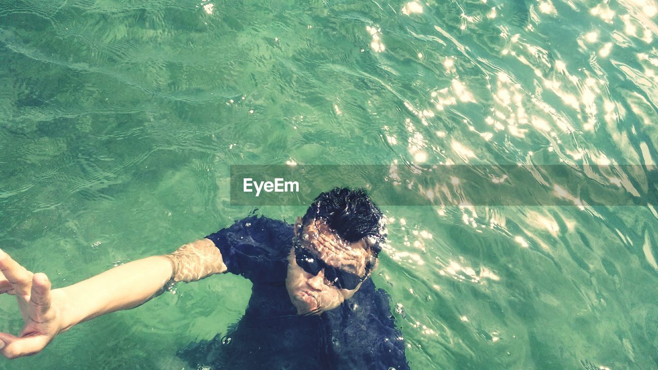 WOMAN SWIMMING IN SEA