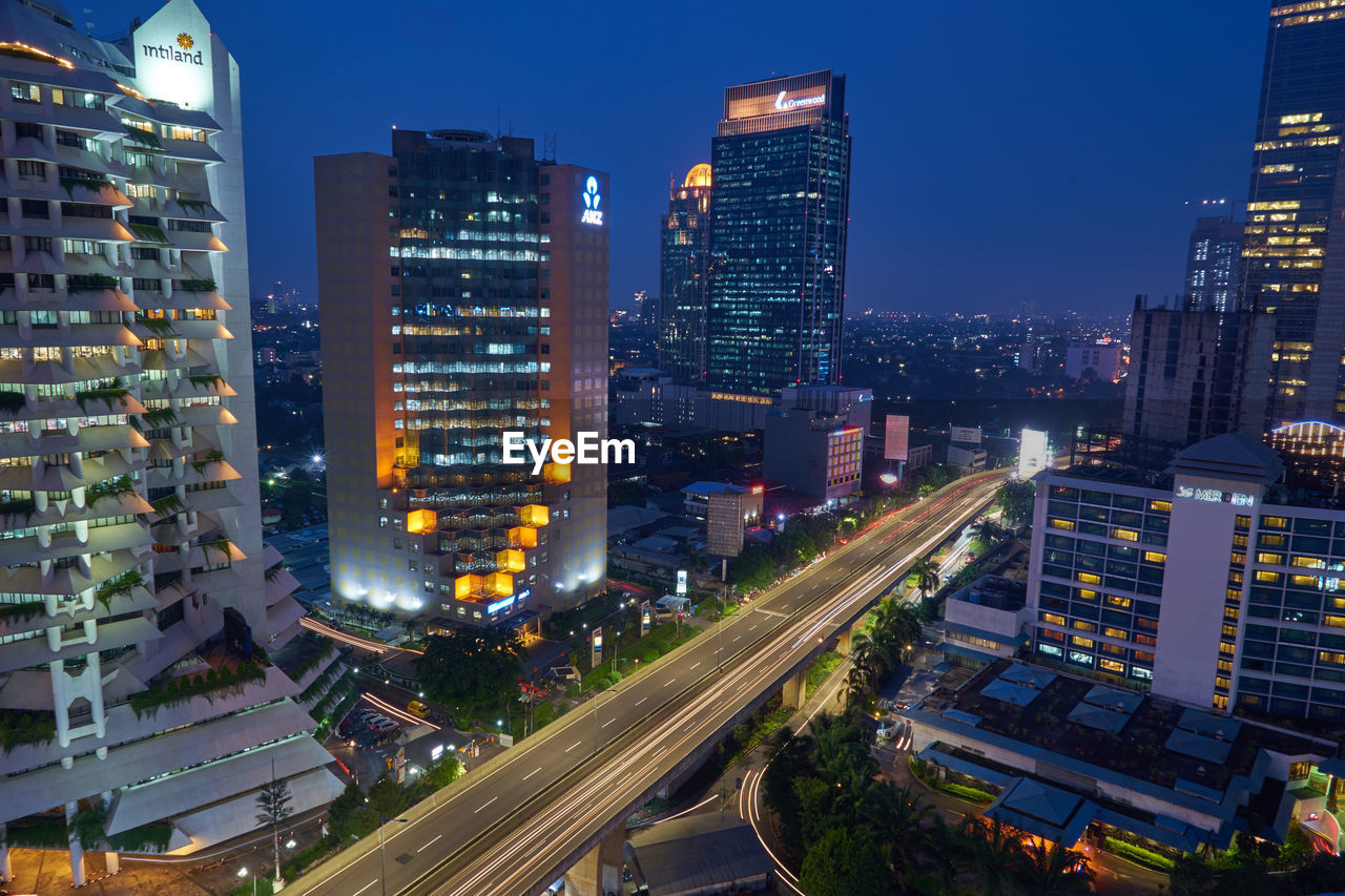 High angle view of illuminated cityscape at night