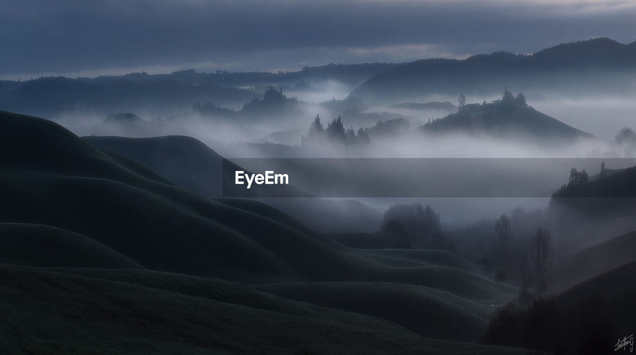 Panoramic view of mountains against sky at dusk