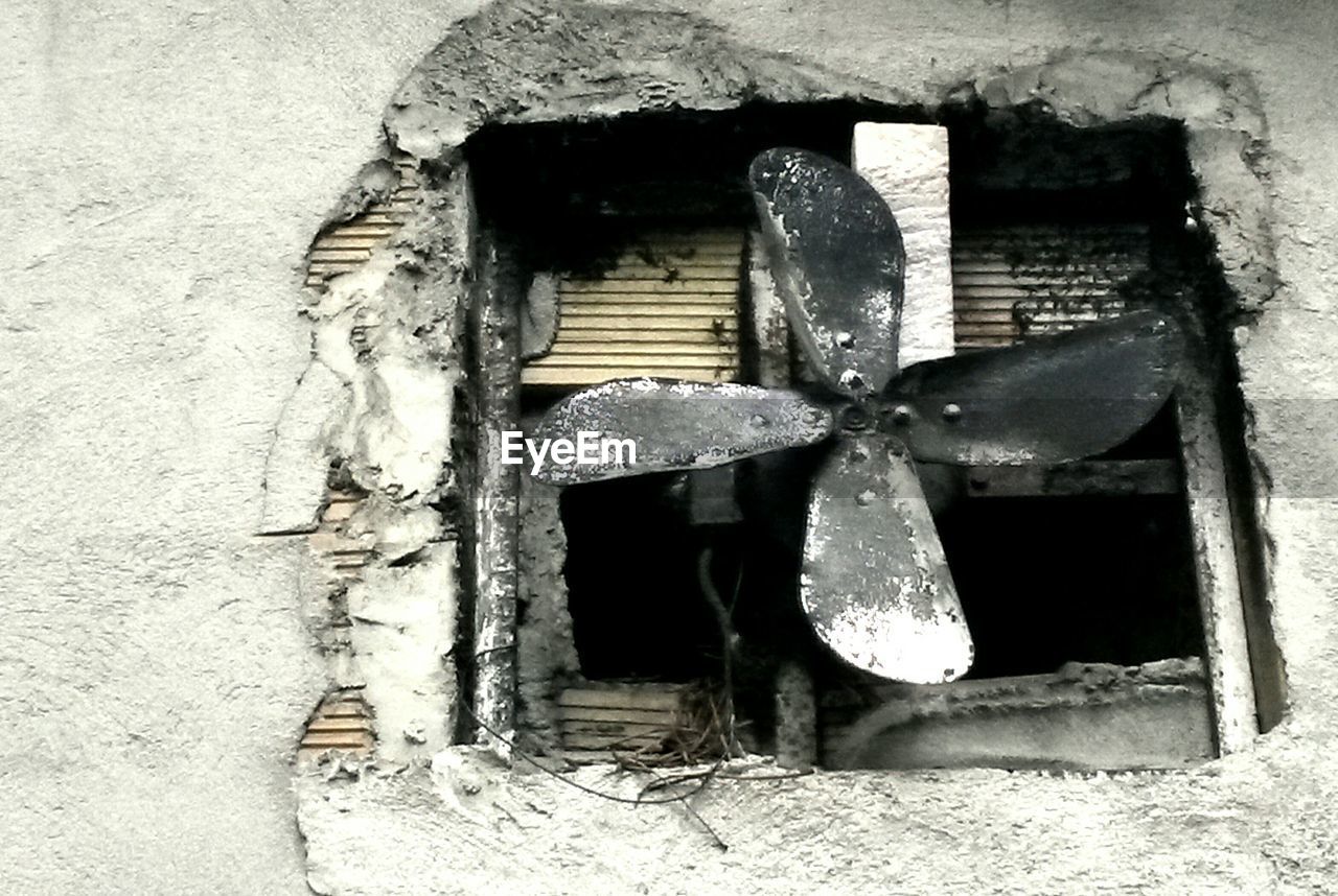 Close-up of exhaust fan on wall