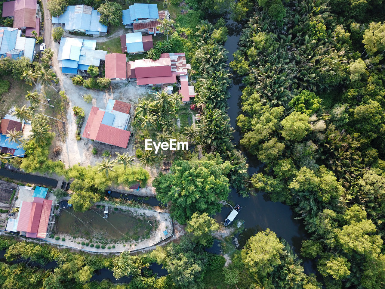 HIGH ANGLE VIEW OF TREES BY BUILDING