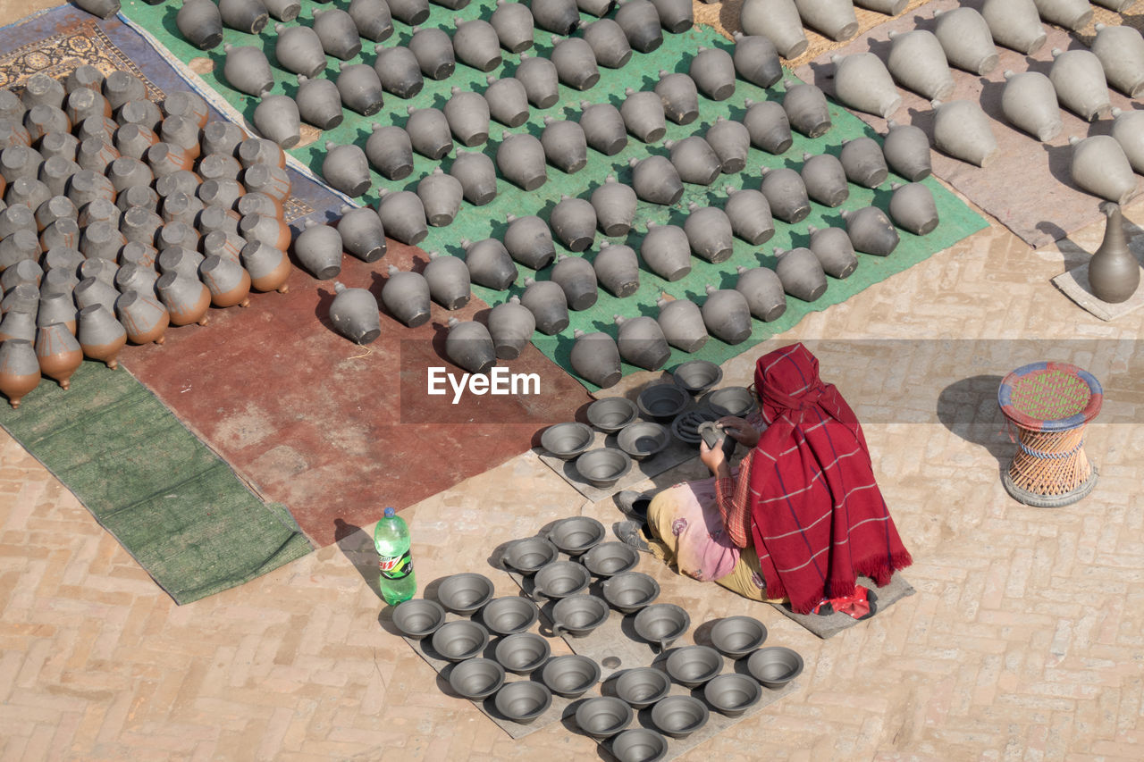 High angle view of woman making earthenware