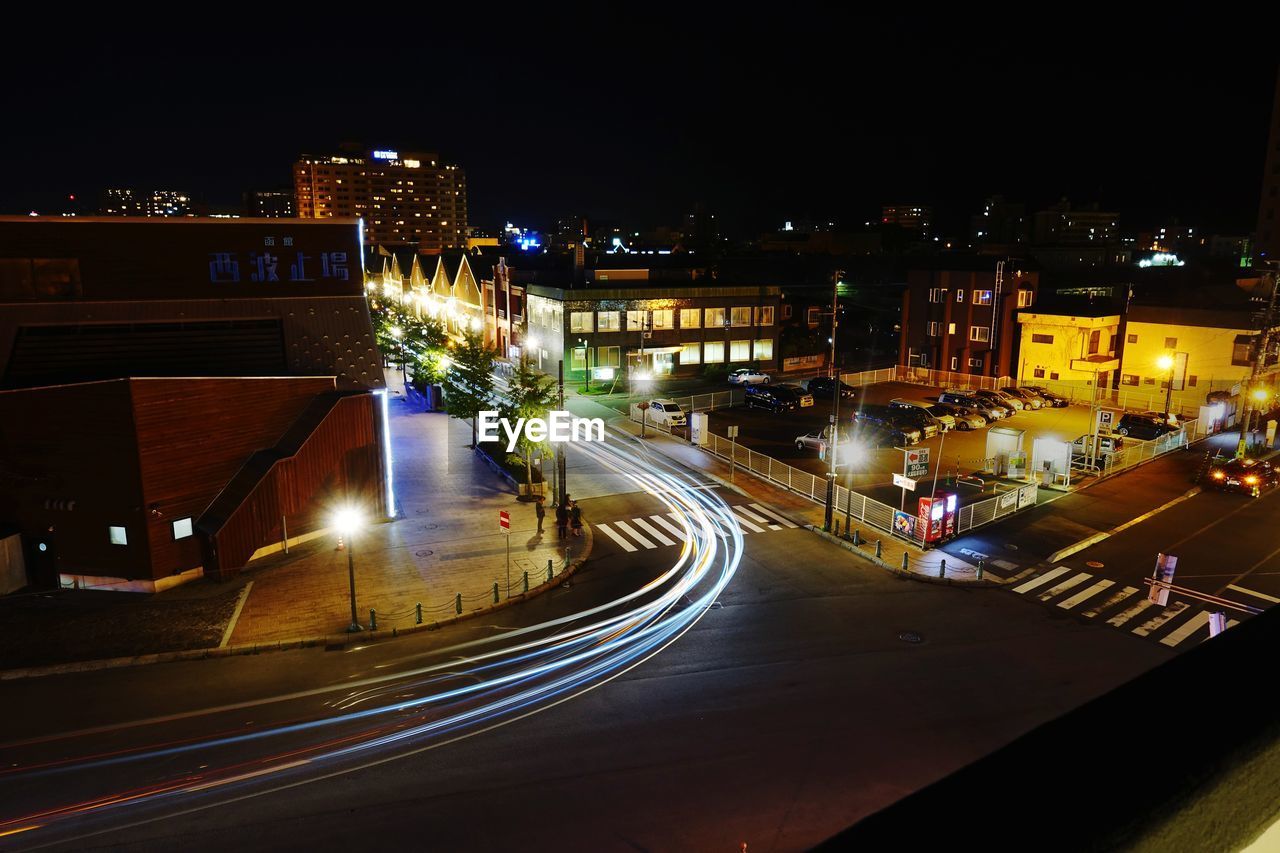 High angle view of light trails on road at night