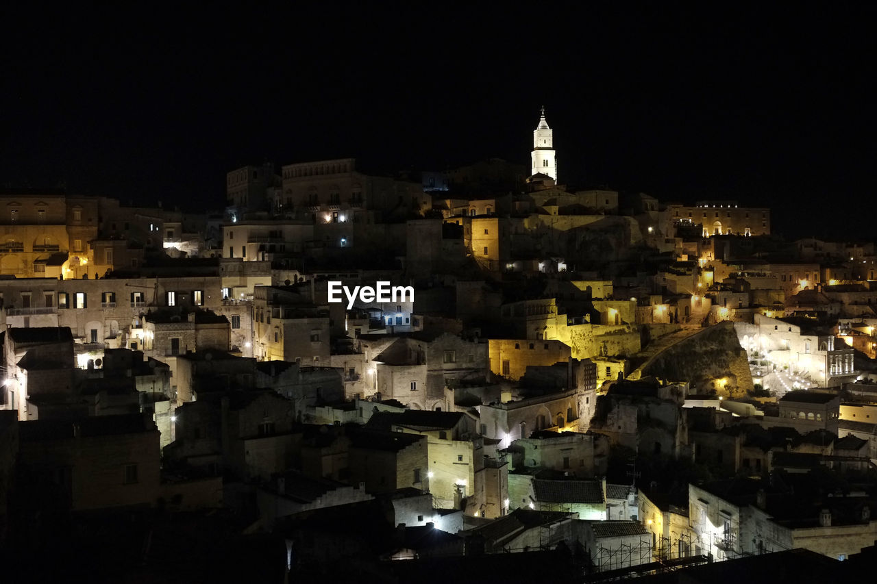 High angle view of illuminated buildings in city at night