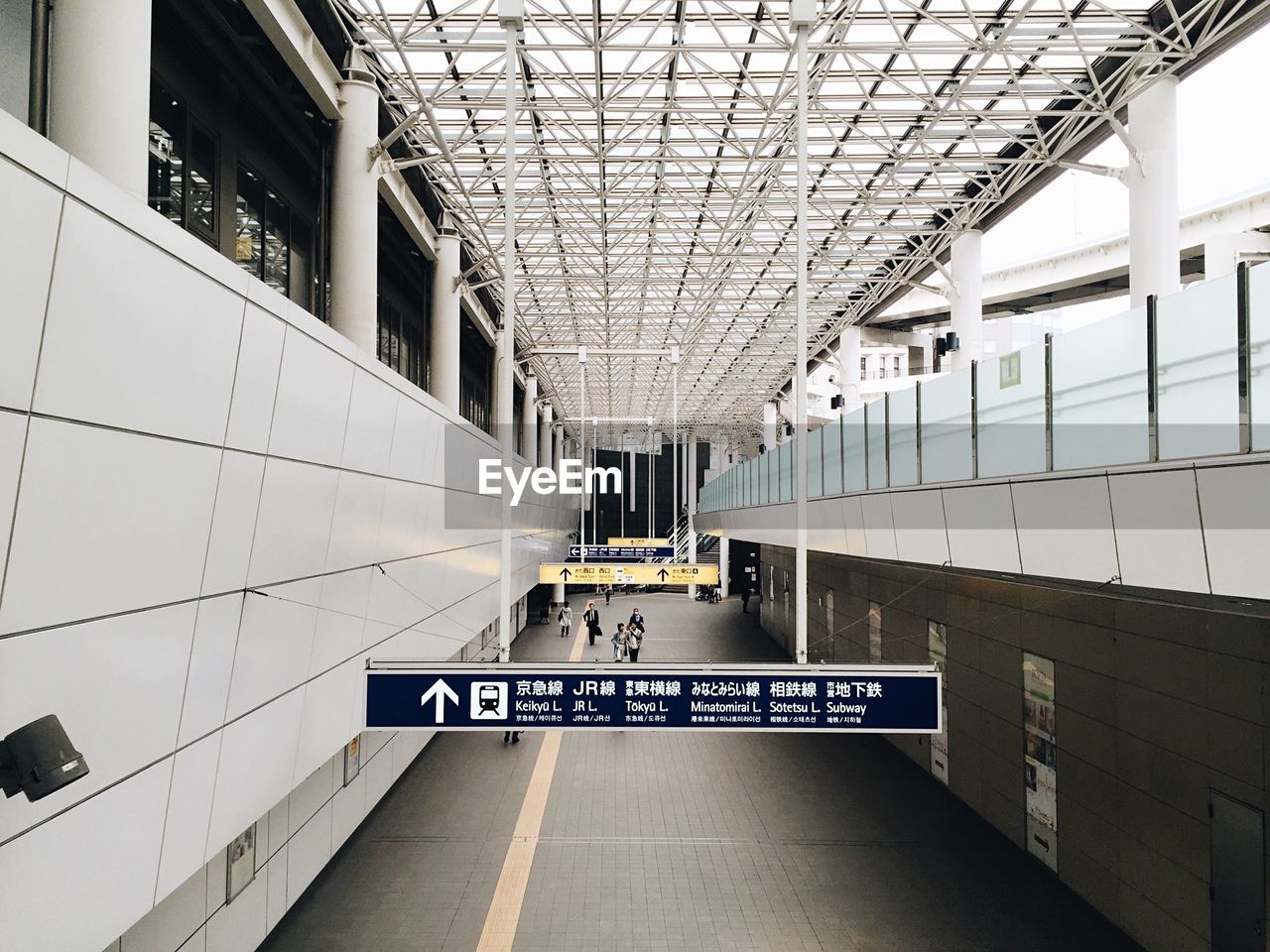 High angle view of people walking in airport lobby