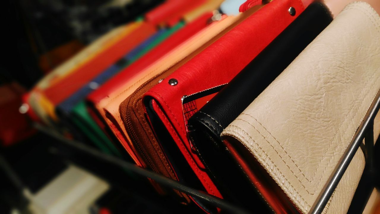 Close-up of colorful purse for sale at market