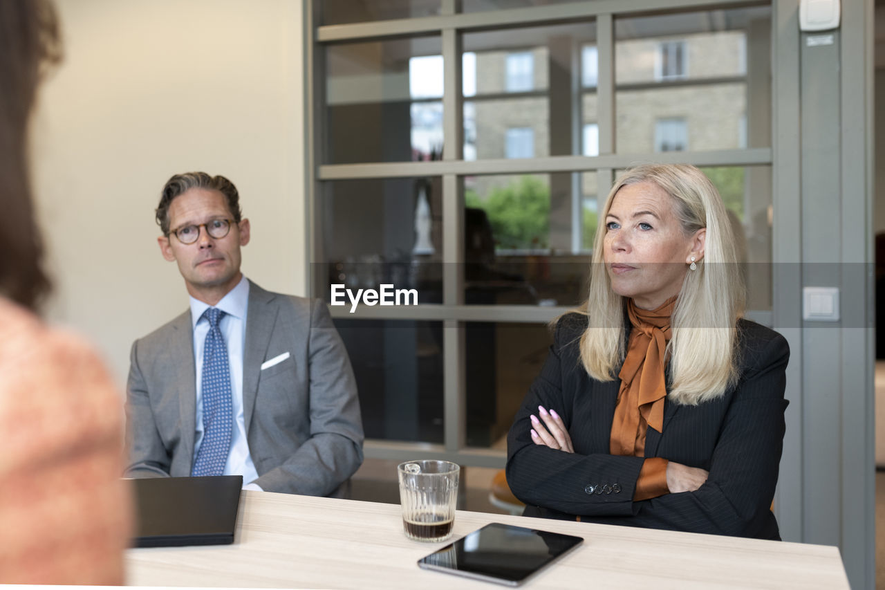 Business people sitting at business meeting