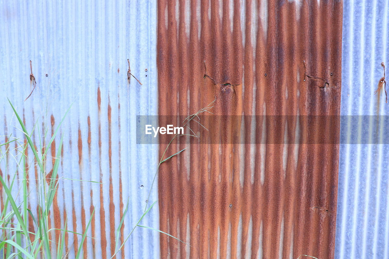 FULL FRAME SHOT OF BLUE METAL DOOR WITH TEXT