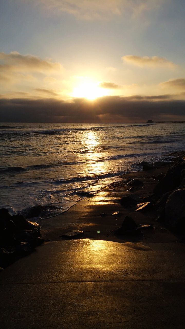 SCENIC VIEW OF SUNSET OVER SEA