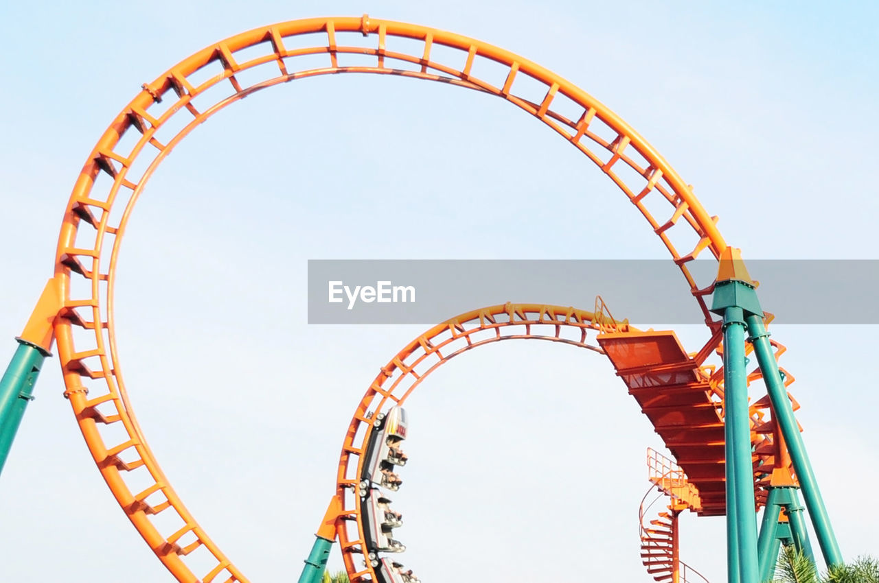 Low angle view of rollercoaster against sky